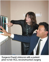 David P Johnson and patient looking at X-rays